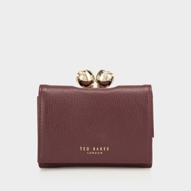 Ted Baker dark red pebbled leather wallet with gold-tone bobble clasp frame top closure, compact fold design