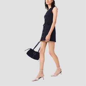Model wearing Maje Womens French Dress in navy, styled with a black shoulder bag and silver kitten heel mules.