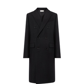 Ami Paris black double-breasted wool coat with peaked lapels, flap pockets, and longline silhouette