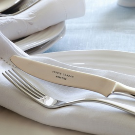 Arthur Price Sophie Conran Rivelin silver 18/10 stainless steel knife and fork on white plate, lifestyle table setting
