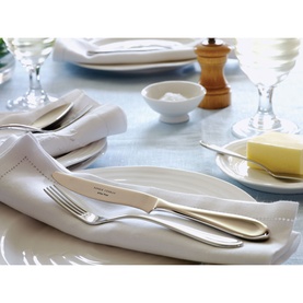 Arthur Price Rivelin Eight-Person Cutlery Set 34-Piece in silver, styled on a formal dining table with glassware, plates and condiments.