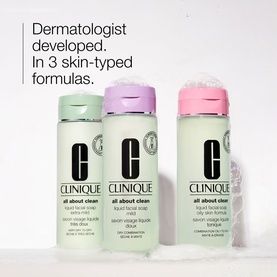 Clinique Liquid Facial Soap shown in three skin-typed formulas: extra mild, mild, and oily skin, in green, purple, and pink bottles.