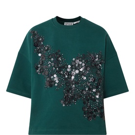 Essentiel Antwerp green sweat top with scattered black and silver sequin floral embellishment on front, crew neck, short sleeves