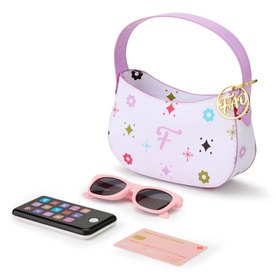 FAO Schwarz multi coloured toy handbag set with floral and star print, including play sunglasses, phone, and card accessories