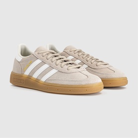 Adidas trainers in khaki and off-white with three white stripes, suede upper, and gum rubber sole