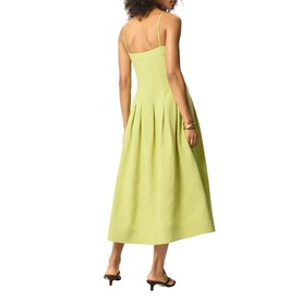 Model wearing Whistles green midi dress with pleated skirt and thin straps, shown from behind, styled with black heeled mules