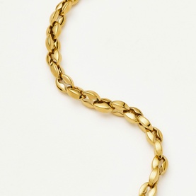 Missoma gold chain bracelet with oval polished interlocking links on a white background.