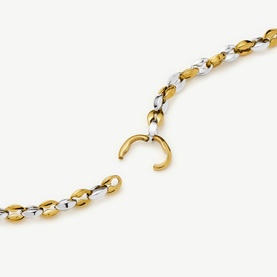 Missoma necklace in gold and silver two-tone chain links with hook clasp detail, close-up view