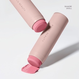 Poco Beauty Universal Cream Stick in Doll shade, pink cream stick shown open and closed in blush pink packaging