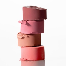 Poco Beauty Universal Cream Stick Cheek and Lip in Bare It All, four stacked bullet shades ranging from deep rose to warm peach and bright pink.