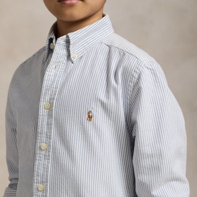 Model wearing Ralph Lauren light blue stripe shirt with button-down collar and embroidered Polo Pony logo, children's