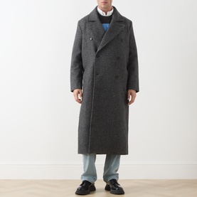 Model wearing Samsoe & Samsoe Dark Grey Mel wool blend double-breasted longline coat, styled with blue sweatshirt and light grey jeans.