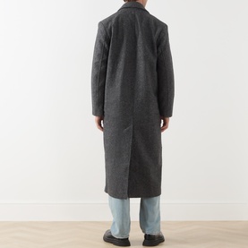 Model wearing Samsoe & Samsoe Dark Grey Mel wool blend coat, rear view, styled with light blue jeans.
