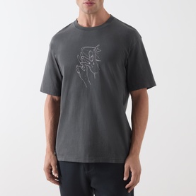 Model wearing Samsoe & Samsoe Black Lines crew neck T-shirt with contrast line-art hand graphic print on chest