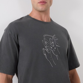 Model wearing Samsoe & Samsoe Black Lines crew neck T-shirt, oversized fit with tonal hand graphic print on chest