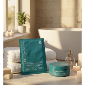 The Skin Nerd Eye-Light Eye-Bright Arbutin Under-Eye Pads pot and sheet mask displayed on folded towels with candles and bath in background.