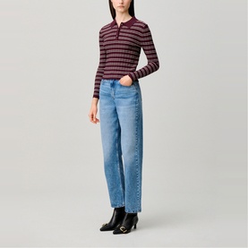 Model wearing Claude Pierlot Straight Leg Jeans in blue denim, faded finish, styled with a striped long-sleeve polo top and black ankle boots.