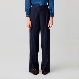 Model wearing Claude Pierlot Straight Leg Trousers in blue with front ankle slits and button placket, styled with a denim shirt.