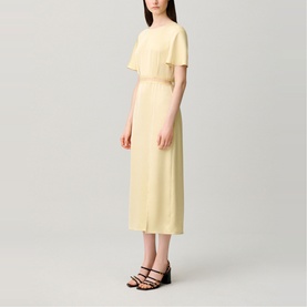 Model wearing Claude Pierlot Lace Slit Dress in baby yellow, midi-length satin-effect fabric, short sleeves, styled with black strappy heels
