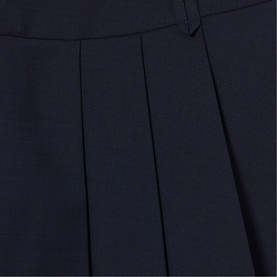 Claude Pierlot Asymmetric Pleated Mini Skirt in navy blue wool blend, showing flat pleats detail and thick waistband with belt loops.