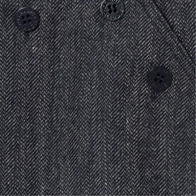 Claude Pierlot black herringbone woven fabric close-up, featuring dark horn-style buttons and a chest pocket detail.