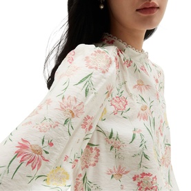 Model wearing Hobbs ivory multi floral dress with frill neck collar and long sleeves, pink and yellow botanical print