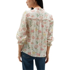 Model wearing Hobbs ivory multi floral blouse with ruched sleeves and lace trim detail, styled with blue jeans
