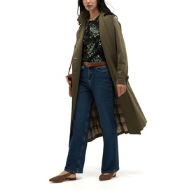 Model wearing Hobbs navy multi long trench coat, styled with dark floral top, blue jeans, and brown loafers