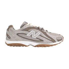 New Balance trainer in Dark Olivine Gum, suede and mesh upper with silver NB logo, white midsole and gum rubber outsole
