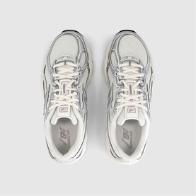 New Balance trainers in Sea Salt Truffle Salt, overhead view showing white lace-up design, mesh and leather panels, off-white chunky sole