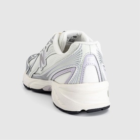 New Balance 530 trainer in Sea Salt Truffle Salt, rear three-quarter view showing mesh upper, silver overlays and off-white chunky sole