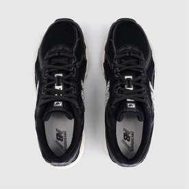 New Balance trainers in black sea salt leopard, overhead view showing suede upper, lace-up front and silver logo detail