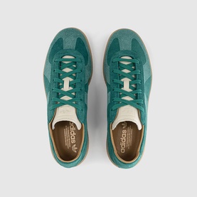 Adidas trainers in Active Green suede with cream toe box, tan insole, and gum sole, top-down view