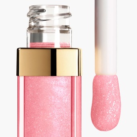 Chanel Lip Gloss in 432 Cristal, sheer pink shimmer formula shown in open tube with applicator wand