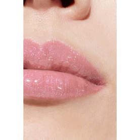 Chanel lip gloss in shade 432 Cristal, shown on lips with a sheer, glossy pink finish and subtle shimmer