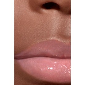 Chanel lip gloss shade 432 Cristal worn on lips, showing a sheer glossy finish with a subtle pink-nude tone