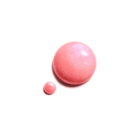 Chanel nail varnish swatch in 421 Cristalline, sheer pink with shimmer finish, shown as large and small droplets