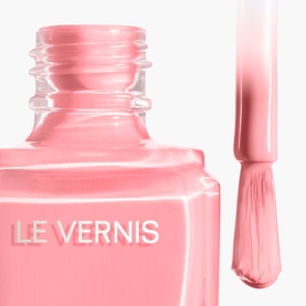Chanel Le Vernis nail varnish in 421 Cristalline, sheer pink shade, open bottle with brush applicator shown