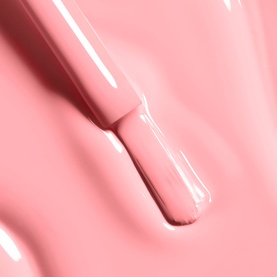 Chanel Le Vernis nail varnish in 421 Cristalline, sheer pale pink shade shown as brush stroke swatch with applicator brush