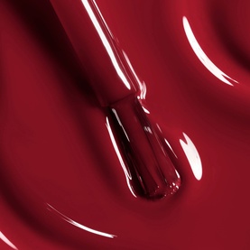 Chanel Le Vernis nail varnish in 421 Cristalline, deep red glossy formula shown as a close-up liquid swatch