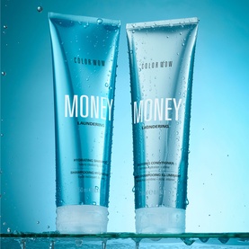 Color Wow Money Laundering Shampoo and Conditioner duo in aqua tubes with water droplets on blue background