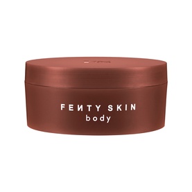 Fenty Skin Amber Bouquet Butta Drop Whipped Oil Body Cream in a round bronze-toned pot with branded lid