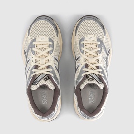 Asics trainers in cream and cocoa powder, overhead flat lay showing mesh upper, lace-up front and grey branded insole