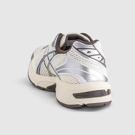 Asics trainer in cream and cocoa powder, silver mesh panelling, chunky off-white sole, rear three-quarter view