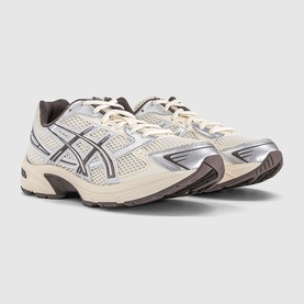 Asics trainers in cream and cocoa powder, featuring silver mesh panelling, dark brown overlays, and a chunky off-white sole