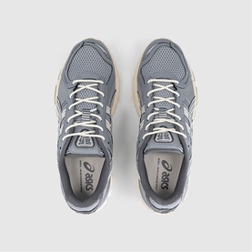 Asics trainers in Piedmont Grey Gravel, top-down view showing grey mesh upper, white lace detail and tonal sole