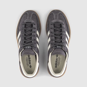 Adidas trainer in Grey Strata, overhead view showing off-white three stripes, gum sole and branded insole.
