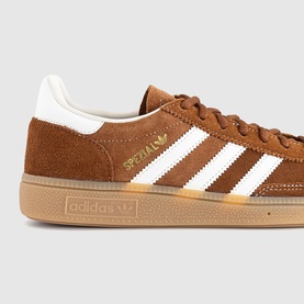 Adidas Handball Spezial trainers in Dusky Bronze and off-white suede with white stripes and gum sole, gold branding detail.