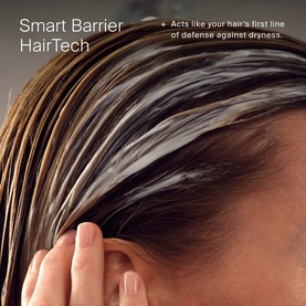 Living Proof Smart Barrier HairTech treatment applied to wet hair, highlighting hydration and barrier protection against dryness