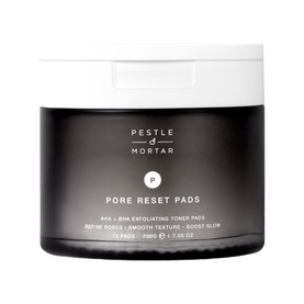 Pestle & Mortar Pore Reset Pads AHA + BHA exfoliating toner pads in a dark round jar with white lid, 75 pads